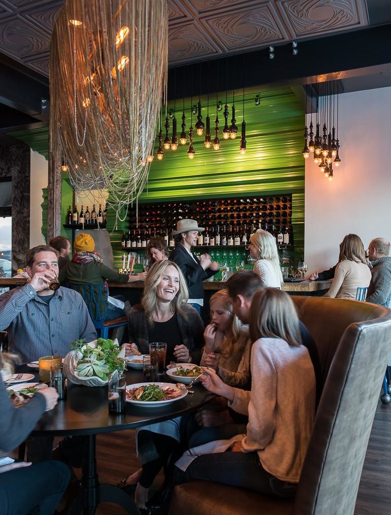 customers dining in feast in Bozeman, Montana in front of bar