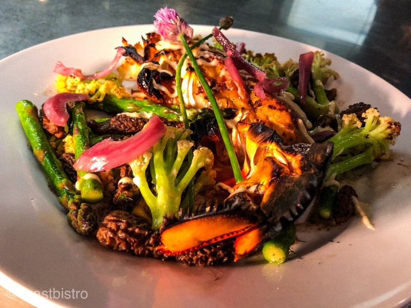 lobster and crab over seasonal vegetables