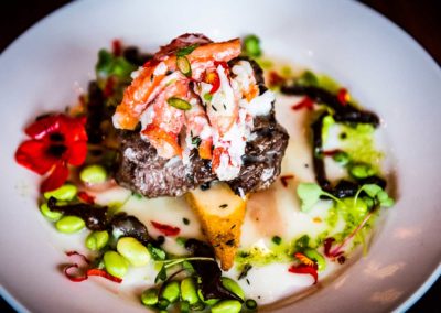 Feast bistro tenderloin served with seasonal vegetables and seafood